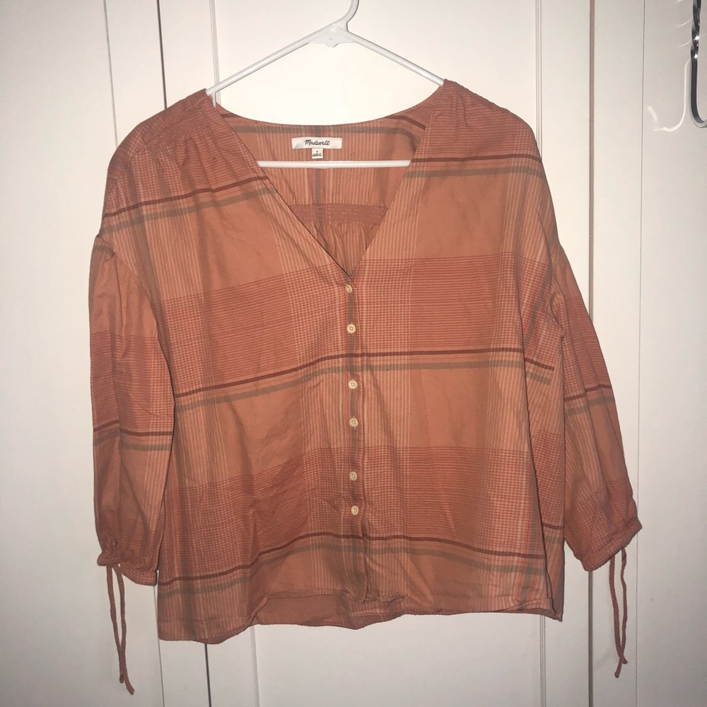 orange flannel-like button down top